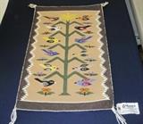 Very rare vintage Navajo Bird Pictorial (Tree of Life) Rug, 16" x 26", woven by Evelyn Tunney (Tsosie) from the Cedar Ridge area of the Navajo Reservation. She is considered to be the foremost expert in Bird Pictorial Weavings. Original tag from Garland's Navajo Rugs of Sedona, Arizona, who was the exclusive seller of her rugs.