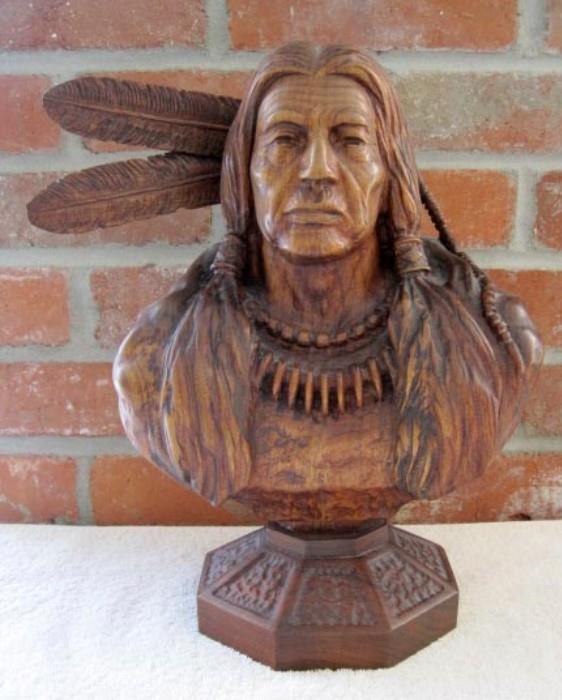  1980 Pershing Geiger (Wyoming 1922-1996) wood carving entitled "Cheyenne Wisdom", a one of a kind sculpture.                                                                                        
THIS ITEM WILL BE SOLD BY SEALED BID. Bid forms will be available and bids may be submitted at the sale until 4pm on April 30th. 
At 4pm, the bidding will close, the sealed bids will be opened, and the winners will be notified. 
Absentee bids may be placed through 5pm MST Friday April 29th by calling Wyoming Estate Services at 307-577-1553.