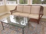 Wicker sofa, Matching wicker chair, Karastan run, glass top table