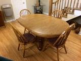 Dining Table and Chairs.  Top is laminated to protect from those family spills!