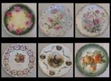 A sampling of porcelain plates. Some have Minnesota advertising. Most are German made.
