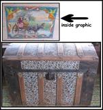 Camel back trunk with inside graphic of two women stuck in the water with a mule. 