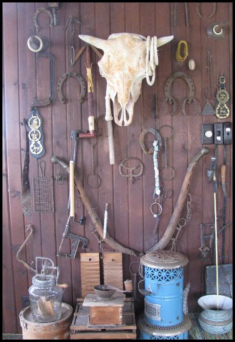 Primitives, kerosene heater, horseshoes, skull, tack