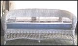 White wicker loveseat.
