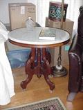 Another oval marble top table
