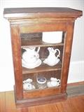 Small antique oak cabinet with bowls and pitchers