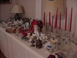 Lots of teapots, tea cups and saucers, candlesticks, and more