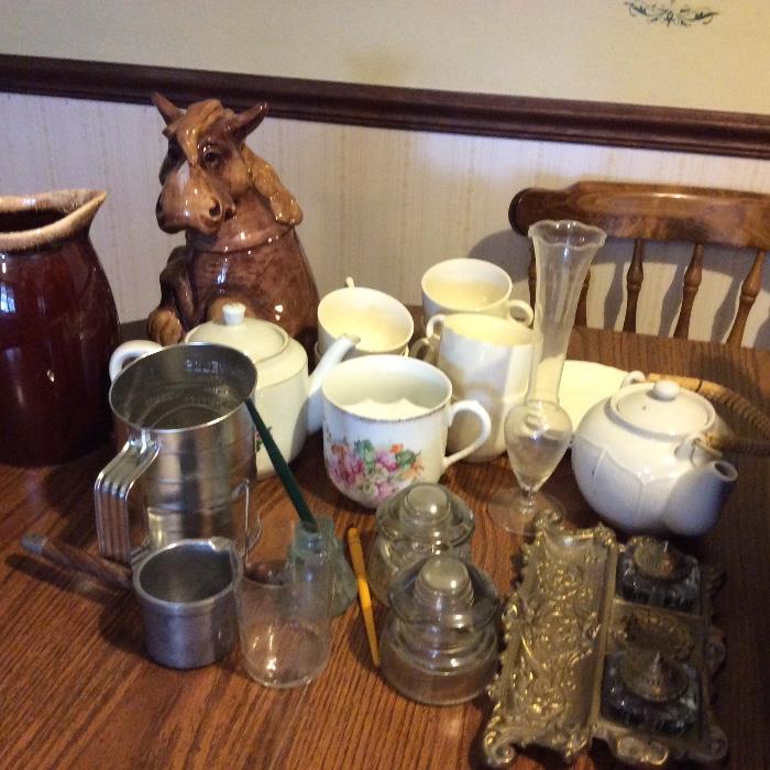 ink wells, horse cookie jar, sifter, insulators used by the phone company.