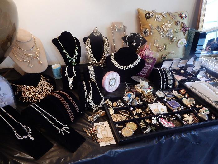 TABLE OF FUN AND FUNKY JEWELRY, bracelets, clip earrings, necklaces, rings, watches, the list goes on as does the tables, plus jewelry cases.