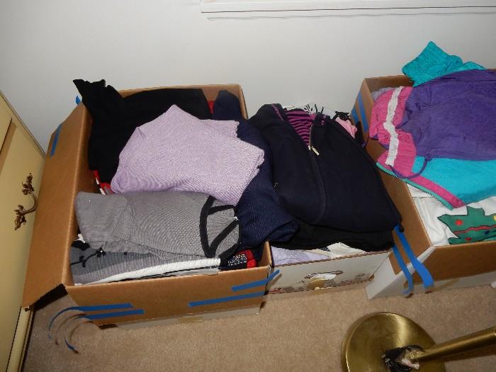 boxes upon boxes of men's and ladies clothing.