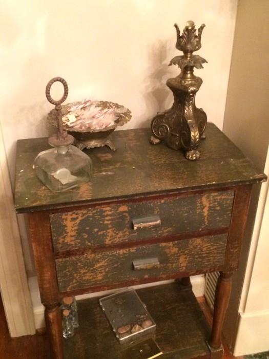 one of a pair of distressed side tables