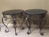 a pair of iron and faux stone top coffee tables