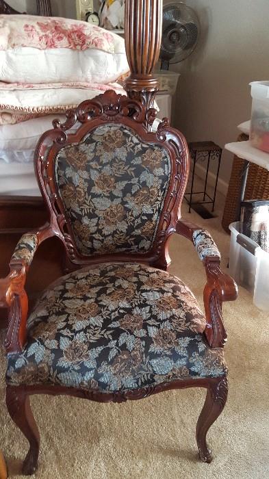 one of the pair of matching armchairs and ottoman