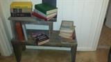 Vintage books including many first editions, handmade shelves/benches. 