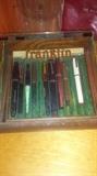 Franklin fountain pen advertising display. Several fountain pens including Parker, Franklin, Wearever Hundred Year pen, and more. 