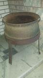 Cast iron cauldron (footed) & metal ring/stand. 