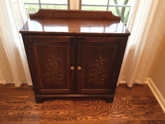 Vintage small cabinet with floral design