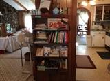 Doing area - Cookbooks, paperback and hardback, miscellaneous glasses, glass cases, plate holders, clock and more