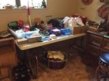 Miscellaneous items in Master Bedroom - clothing, knickknacks, stack of shorts, slips, bras, hats, etc.