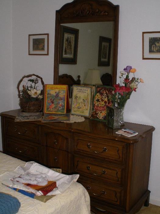 Mirrored chest of drawers, vintage children's picture books.