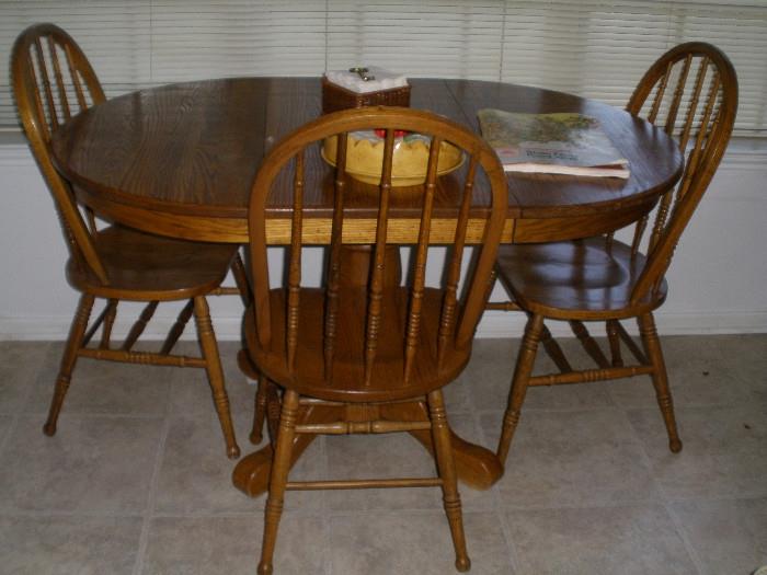 Oak breakfast table and four chairs (one not shown)