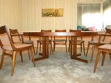 Johs Andersen teak table with one leaf. Table can be a perfect circle without it. Table comes with pads and three leaves.