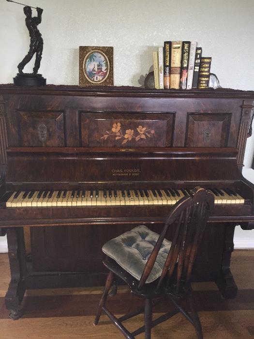 Antique piano   Needs to be refurbished.  