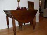 Antique table with three leaves