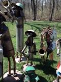 Purchased from artist at Covered Bridge Festival at Turkey Run. The dog plays trombone and the rooster plays a saxaphone!