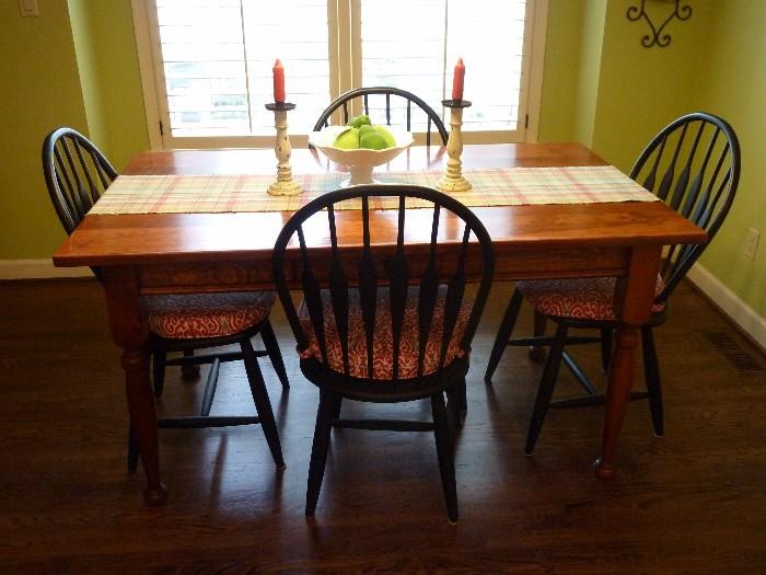 Farmhouse style table and four black chairs