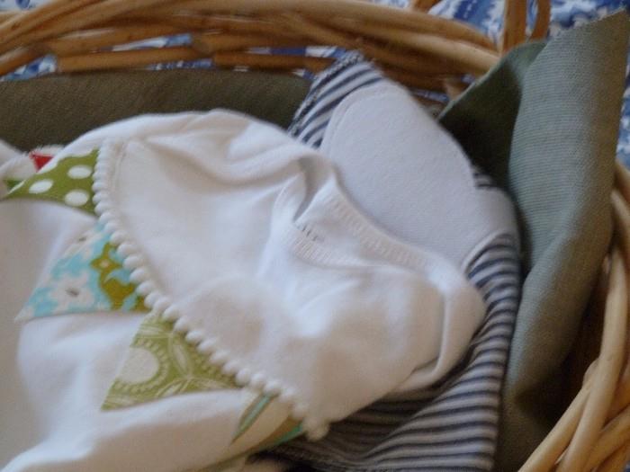 Baby clothes and basket