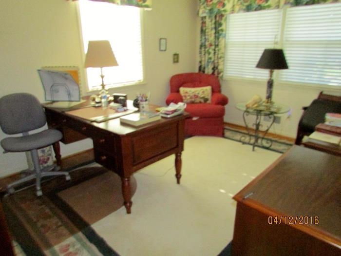Large wool area rug, great executive desk with pull-out keyboard, comfy red lounge chair