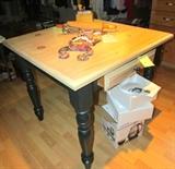 Square kitchen table with green base, storage drawer