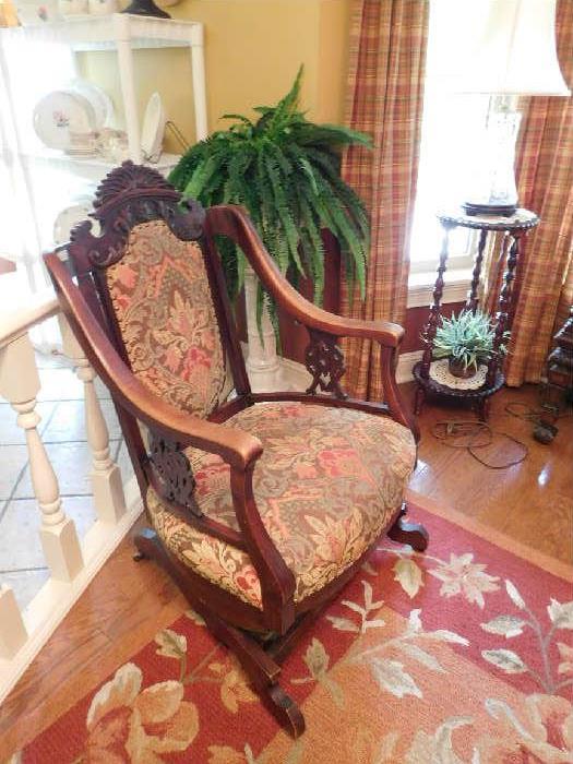 Ornately carved antique rocker