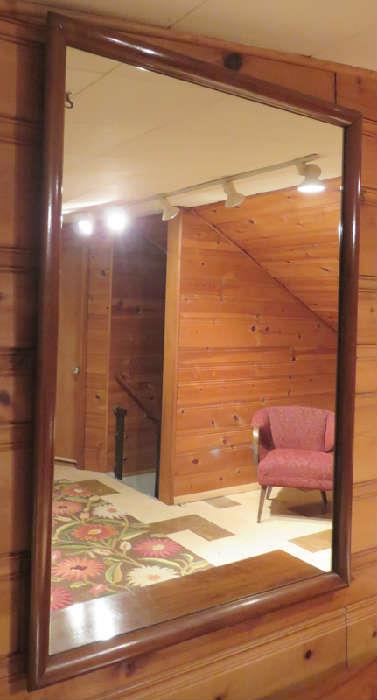 Mid-century modern solid walnut wall mirror manufactured by American of Martinsville, Dania collection. Designed by Merton Gershun.