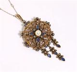 Lot# 1003 An antique European sapphire, cultured pearl and diamond pendant-brooch 









Circa 1890, silver-topped yellow gold, set with 8 marquise and 12 round sapphires totaling approximately 2.40 ct., and 144 rose and old mine-cut diamonds totaling approximately 1.00 ct and graded I-J color and SI clarity, centering a cultured pearl measuring 7mm., 23 grams 3 x 1.5'', with later added platinum chain. est:$1500/2000