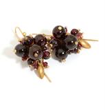 Lot# 1001 A pair of garnet 'Bug Cluster' earrings, Ted Muehling 









Gold tone back with 14K yellow gold wire, approximately 1'' L. est:$250/300