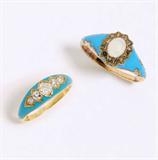 Lot# 1006 A pair of Victorian diamond, opal and blue enamel gold rings 









Two tested 18K yellow gold and blue enamel gold rings, one set with opal and rose-cut diamond surround, the other set across with 5 old mine-cut diamonds totaling approximately 0.50 ct, graded H-I-J color and SI clarity, sizes 6 and 5.5 respectively. est:$1200/1800
