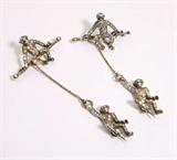 Lot# 1014 A pair of paste monkey brooches 









Circa 1895, two paste, silver and metal whimsical monkey brooches. est:$1000/1500