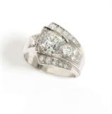 Lot# 1032 A diamond and platinum cross-over ring 









Circa 1925, the central old European-cut diamond weighing approximately 1.35 cts, graded H-I color and VS-SI clarity with remaining 16 old European-cut diamonds totaling approximately 0.50 ct, graded G-H color and SI-I clarity, size 5.5, 7.7 gms. est:$2500/3500