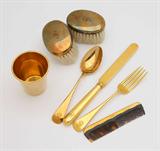 Lot# 1047 A child's 14K gold place setting and partial vanity service 









Probably early 20th century, with unidentified anchor and lion maker's mark, further marked 14K and with various pattern or inventory numbers, comprising: a knife (7.5''), a fork (5.75''), a spoon (5.75''), a cup (2.25'' H x 2'' Dia.), a comb with tortoiseshell teeth (4''), and two brushes with boar bristles (each: 2.75'' x 1.75''), monogrammed ''S'', 7 pcs, total gross weight. 8.3 oz troy approximately. est:$700/900