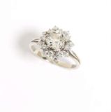 Lot# 1055 A diamond and 18K white gold ring 









Tested 18K, centering an old mine-cut diamond weighing approximately 1.10 cts, graded J-K color and SI clarity, surrounded by 16 full-cut diamonds totaling approximately 0.50 ct, graded H-I color and VS clarity, size 7. est:$1750/2500