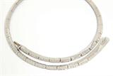 Lot# 1056 A diamond and 18K white gold riviere collar necklace 









Set with 152 full-cut diamonds graded H-I color and VS-SI clarity, 16'', 36.8 gms. est:$3000/5000