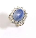 Lot# 1065 A star sapphire, diamond and 14K white gold surround ring 









Set with 14 round full-cut diamonds totaling approximately 1.80 cts, graded H-I color and VS-SI clarity, sapphire measures 15.7 x12.0 x 12.0 mm, size 7. 13.7 gms. est:$2000/3000