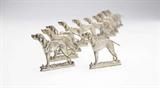 Lot# 1076 A set of twelve German .800 silver dog-form place card holders 









Late 19th / early 20th century, each marked ''B & Z'' and with a recumbent lion, each further marked ''.800'' with crescent and crown and ''Germany'', each in the form of a standing pointer dog, 12 pcs. 1.75'' H x 1.75'' W, 4.9 oz troy tw approximately. est:$500/700
