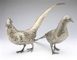 Lot# 1075 A pair of German .800 silver gilt pheasant garnitures, Lutz & Weiss, Pforzheim 









20th century, each with makers mark, crown and crescent and ''800'' and further marked ''Germany'' and ''B'', each inscribed to claw ''B32475'', each realistically modeled, one as a cock and one as a hen, with removable heads and fixed wings, 2 pcs, 52 oz troy tw approximately, the larger. 11'' H x 21'' W x 4'' D. est:$2000/3000