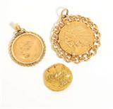 Lot# 1085 A collection of three gold coins 









Two set in gold bezel pendants; comprising: a US Indian head, a Russian ruble and an ancient male profile, 26.8 gms. est:$800/1200
