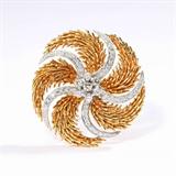 Lot# 1091 A diamond and 18K two-tone gold swirl brooch 









Circa 1950, set with 62 full-cut diamonds totaling approximately 2.40 cts, graded G-H color and VS-SI clarity, 40 gms. est:$2000/3000