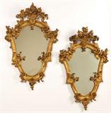 Lot# 1118 A pair of Italian carved gilt wood wall mirrors 









Probably 19th century, each with cartouche-form plate within a conforming surround decorated with C-scrolls and foliage and surmounted with a flower-filled basket, 2 pcs, each. 34.5'' H x 21.5'' W x 3'' D. est:$1500/2000