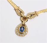 Lot# 1136 A sapphire, diamond and 14K yellow gold necklace 









Centering an oval-cut sapphire measuring 9.5 x 7 x 4.8 mm and gauged at approximately 2.80 cts, surrounded by 39 full-cut diamonds totaling approximately 1.80 cts and graded G-H color and VS clarity, 19'', 34.8 gms. est:$1200/1800